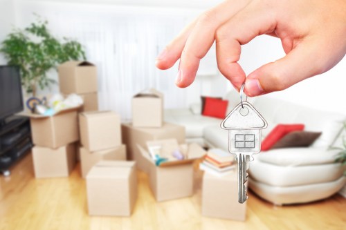Professional movers carrying furniture during a Yiewsley relocation