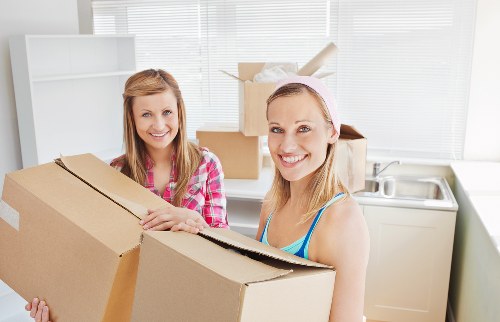 Organised storage space in Yiewsley with labelled boxes and furniture